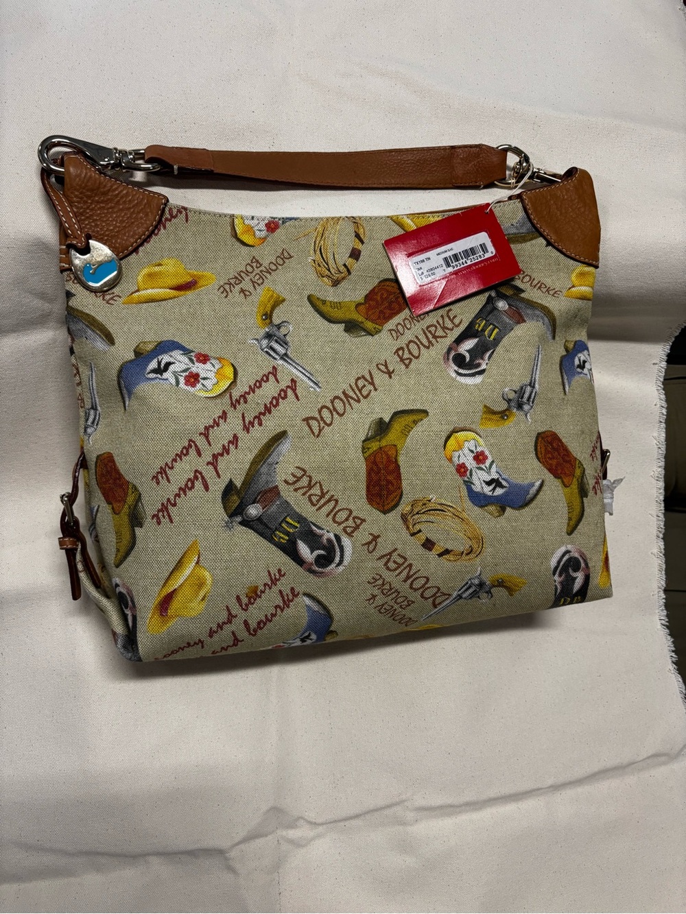 Dooney & Bourke Beige Canvas Western Print Shoulder Bag with Brown Leather Trim - Picture 2 of 6
